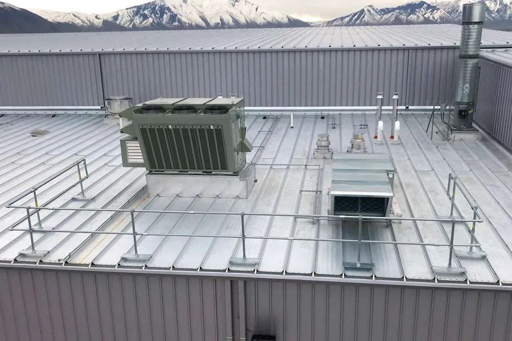 Full view of metal roof guardrail installed for OSHA-compliant fall protection.