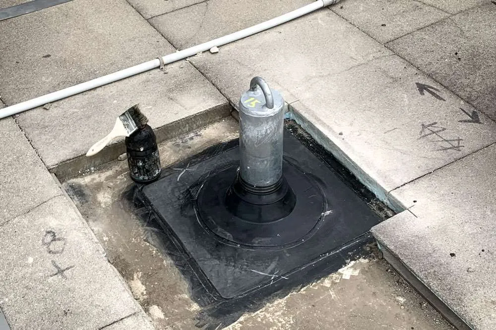 Industrial rooftop tieback anchor engineered for fall protection and suspended access.
